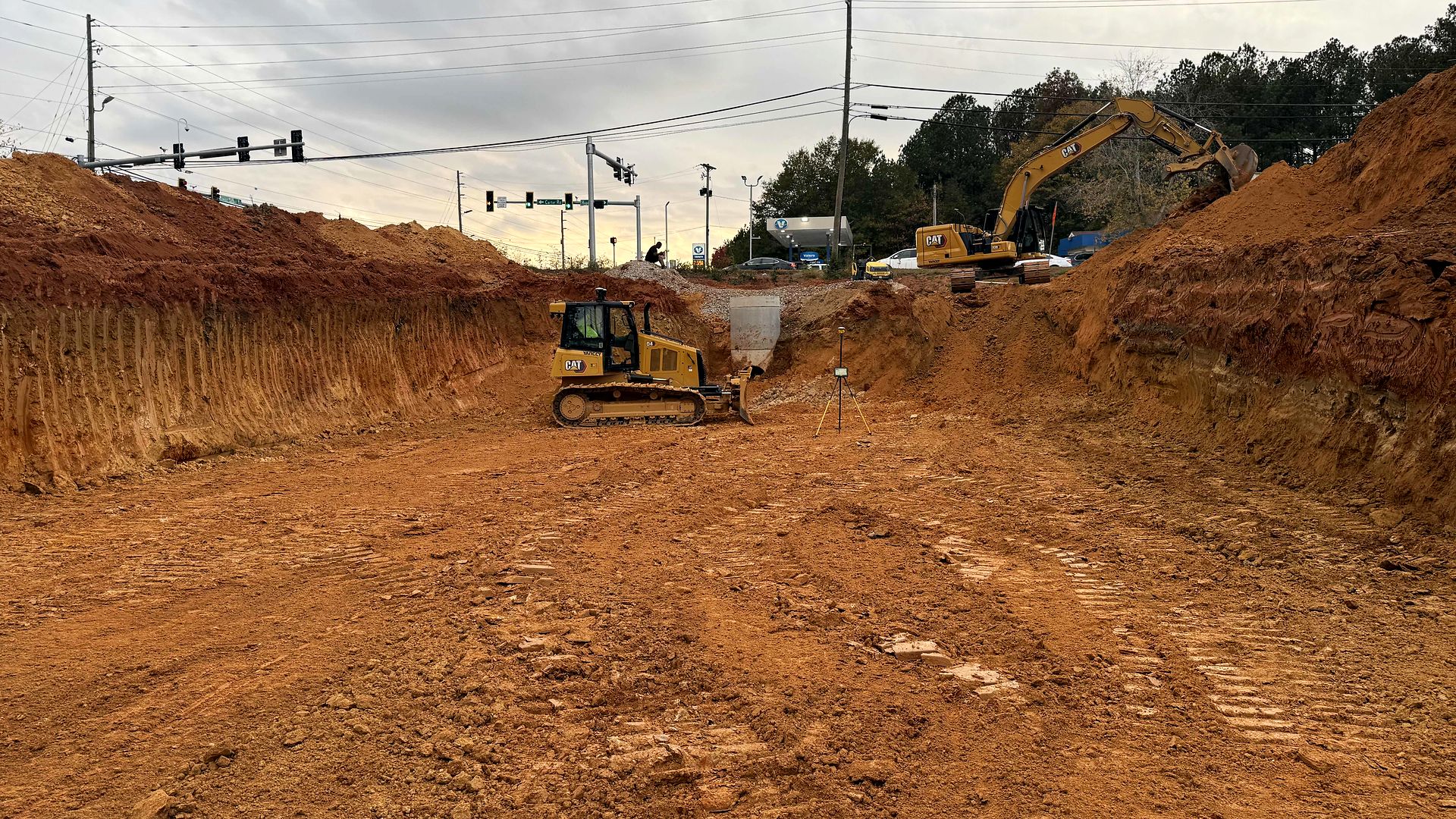 Dozer and excavator on mass excavation at the Twigs Farmers Market site