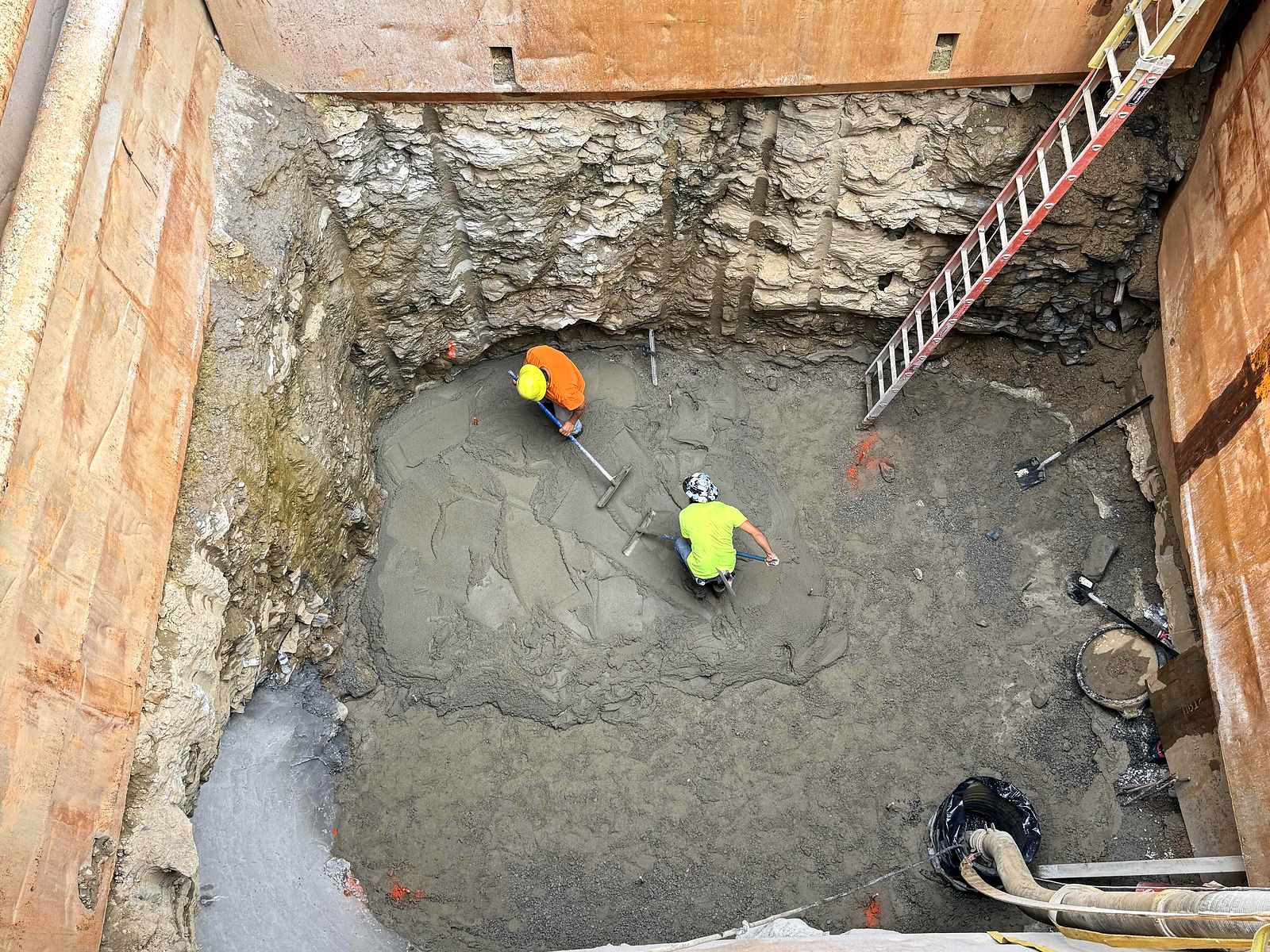 Crew working at the base of a deep shored excavation in Tiftonia, Chattanooga, Tennessee