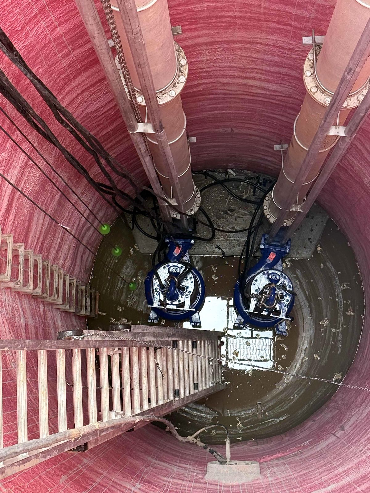 Two submersible pumps at the bottom of the wet well in Blue Ridge, Georgia