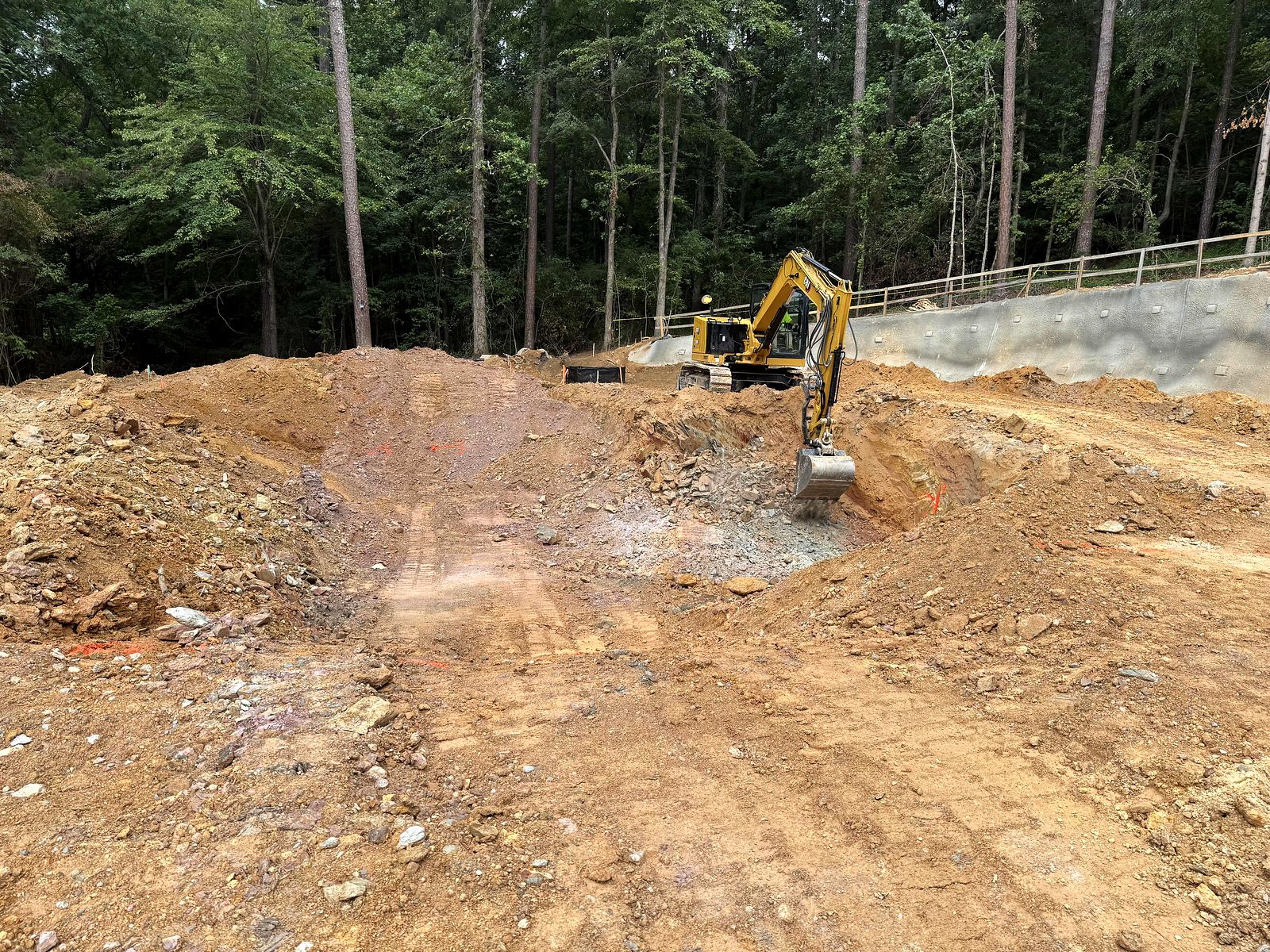 Excavator grading the floor of the pump station excavation in Bartow County, Georgia