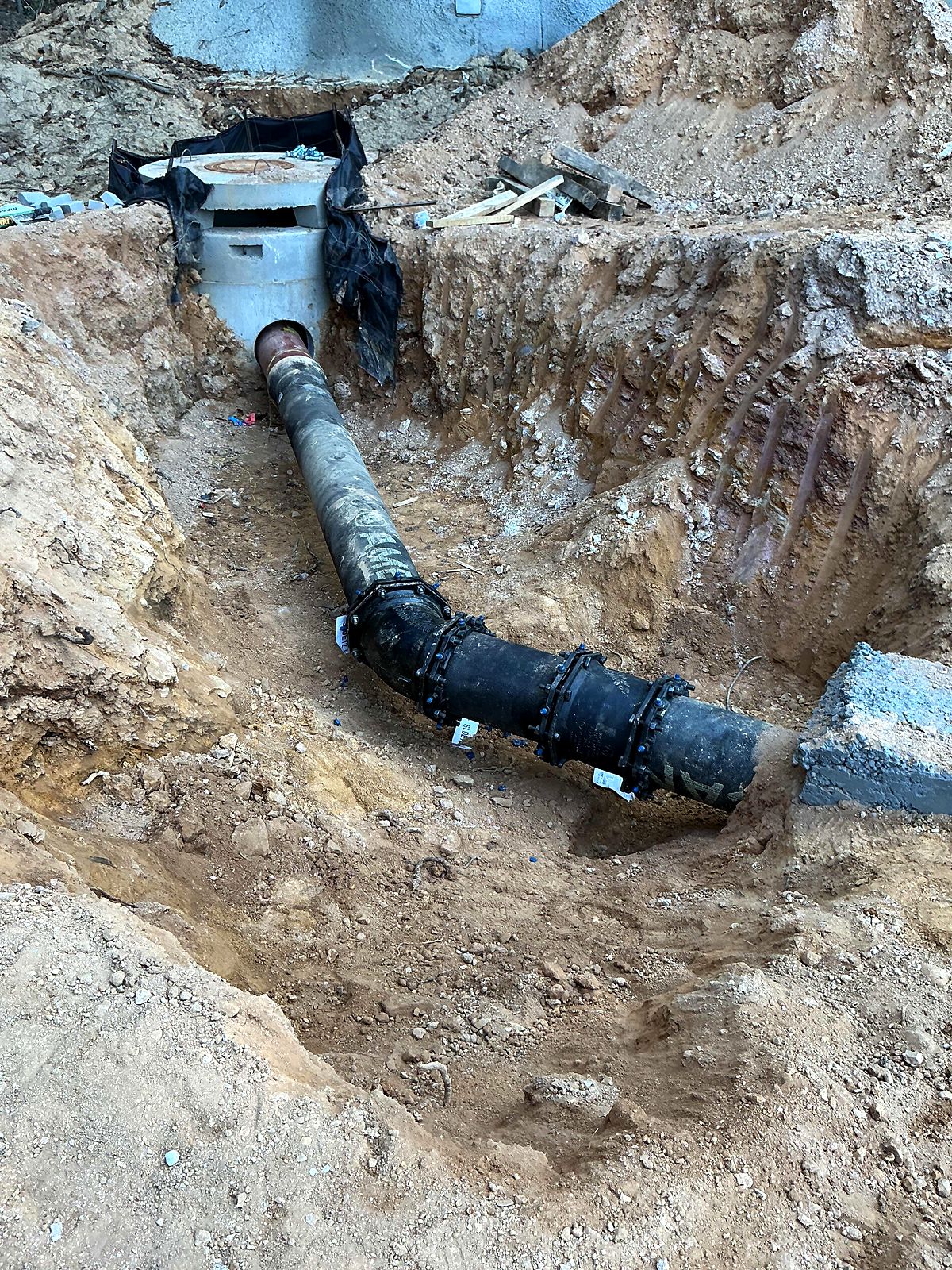 Restrained-joint ductile iron pipe entering a precast structure in Bartow County, Georgia