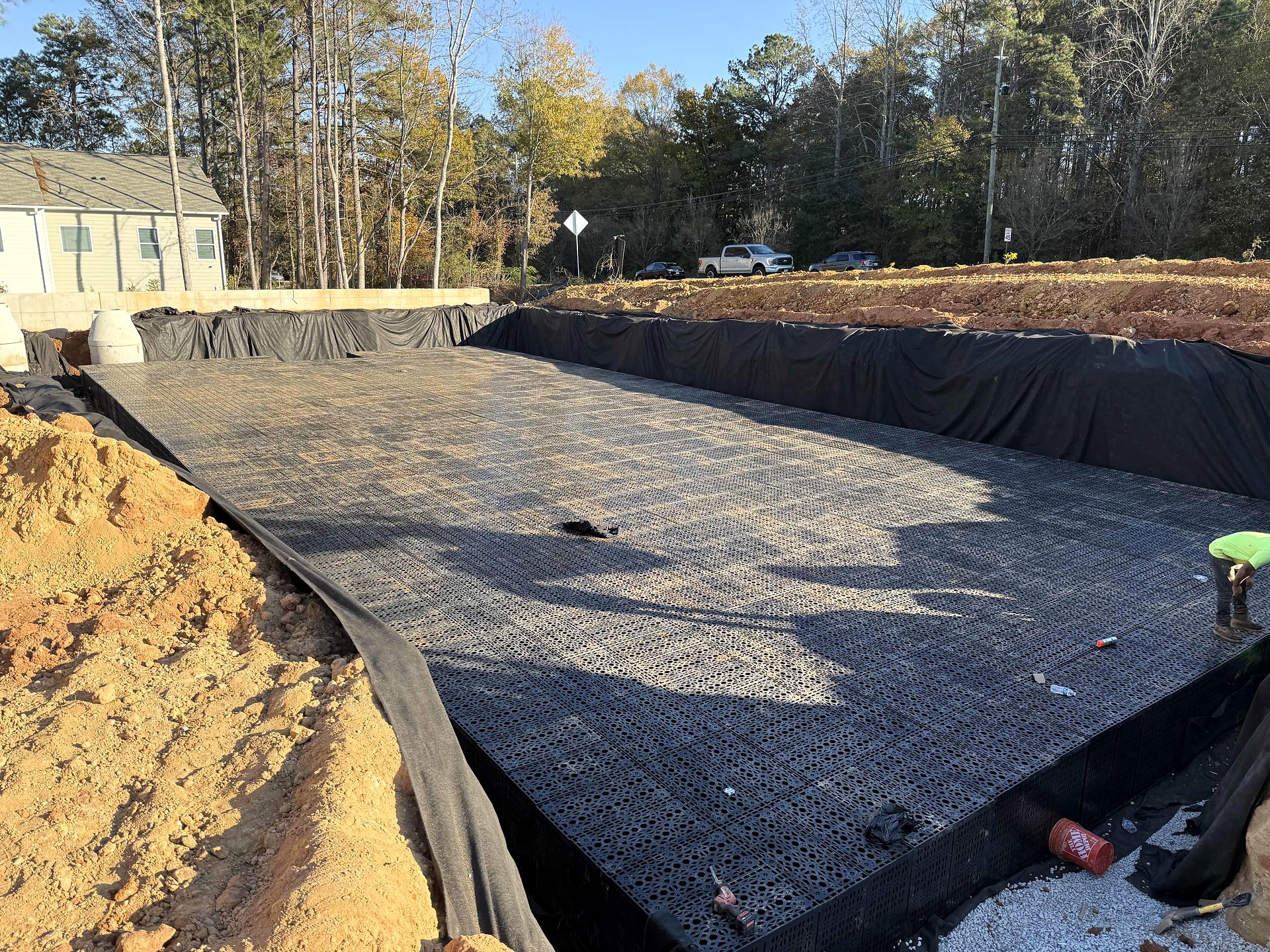 Modular underground stormwater storage system laid in a lined excavation at Twigs Farmers Market